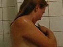 Girlie doesn't shy to be filmed on camera naked. She proceeds showering, when her guy enters bathroom.